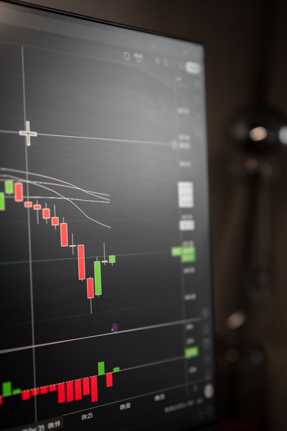 Close-up stock market candlestick chart on a trading monitor