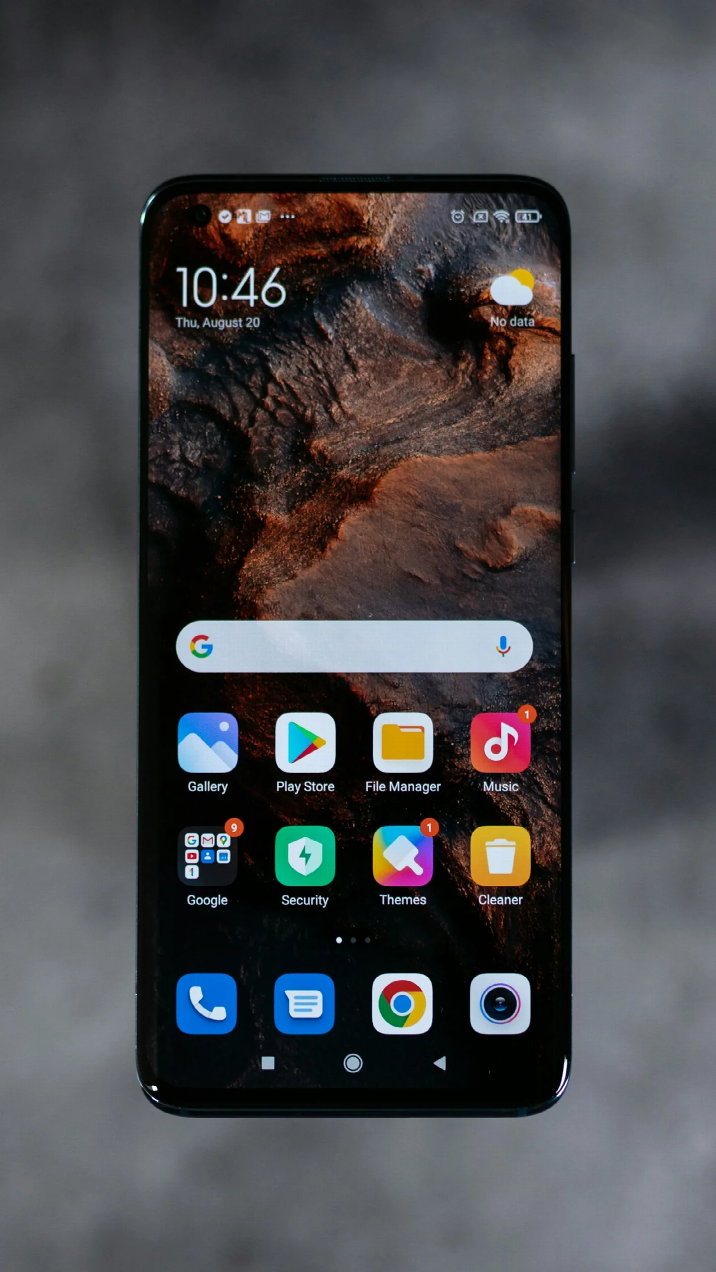 Smartphone home screen showing app icons and widgets