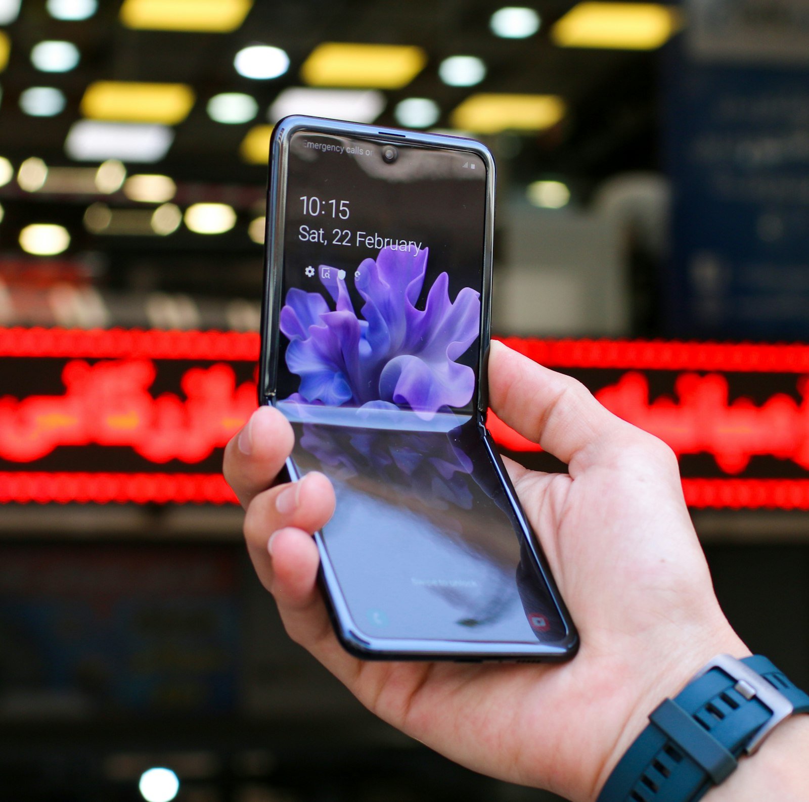 Person holding an unfolded Samsung Android foldable phone