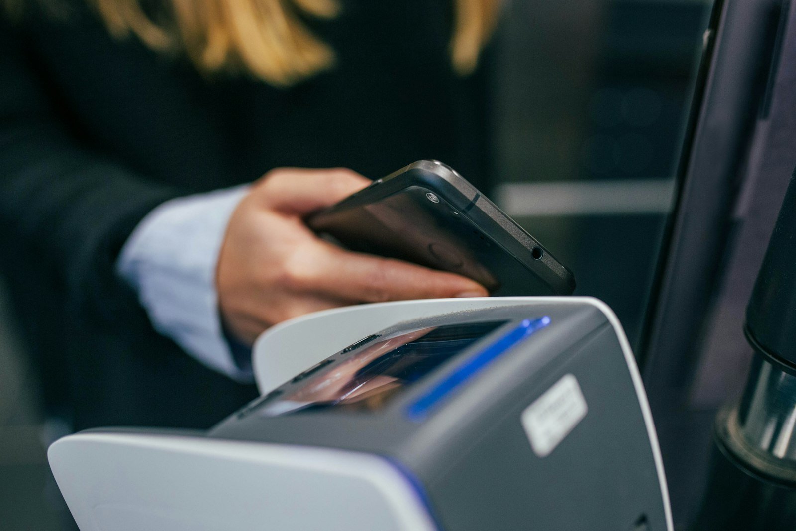 Person holding a smartphone with shallow focus