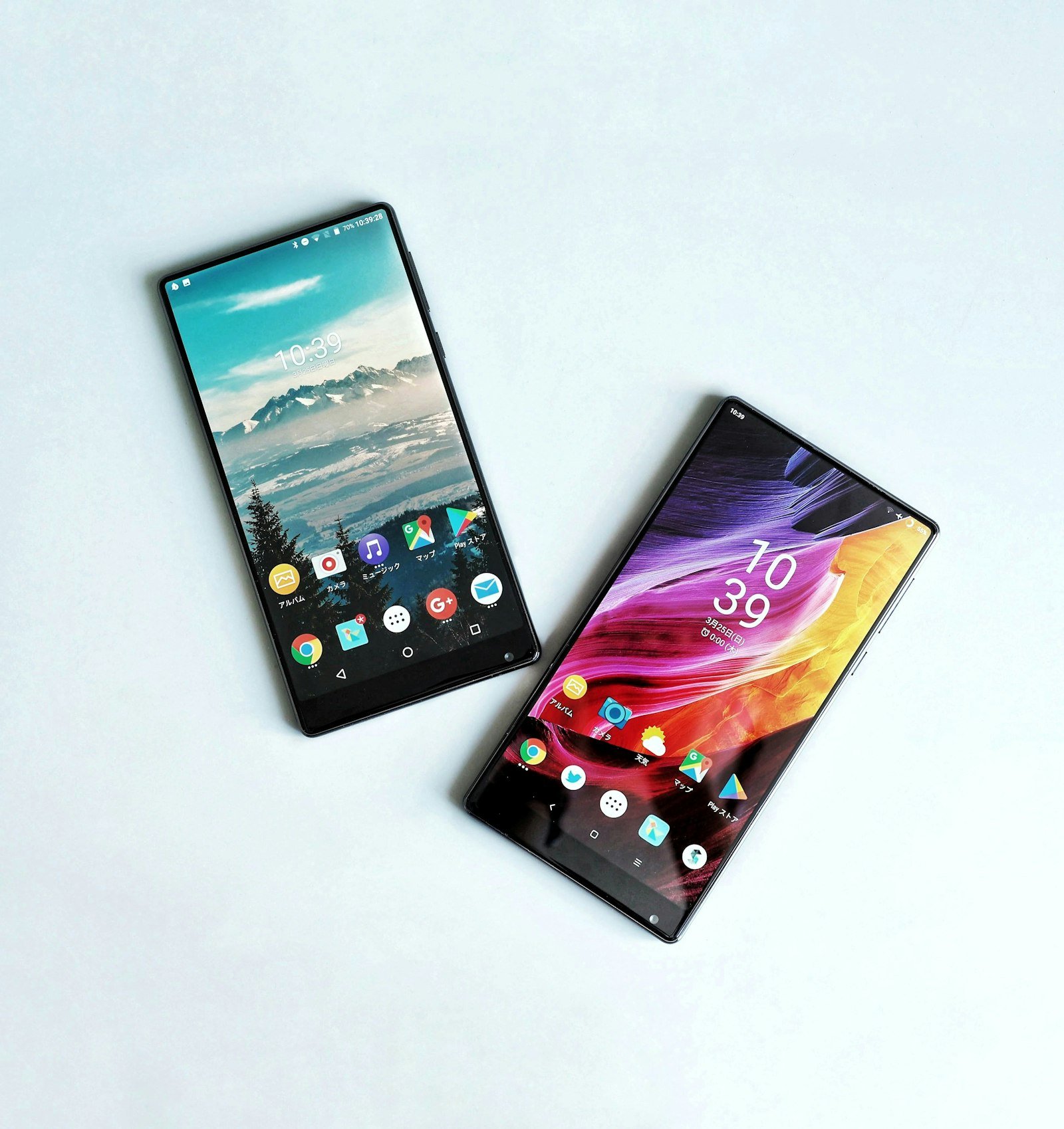 Two smartphones side by side on a white surface for comparison